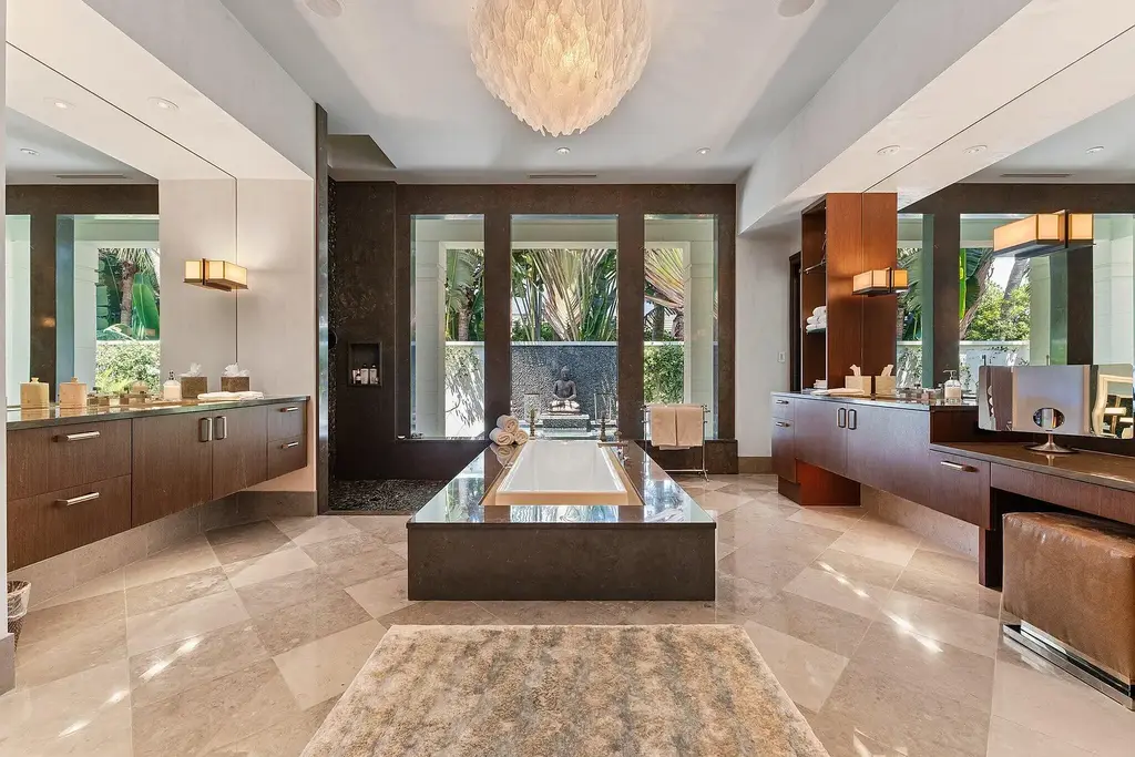 Front exterior view of the luxury $24.5M estate at 232 Bears Club Drive in Jupiter, Florida, showcasing Mediterranean architecture, manicured landscaping, and golf course frontage.