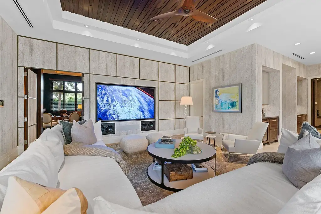 Front exterior view of the luxury $24.5M estate at 232 Bears Club Drive in Jupiter, Florida, showcasing Mediterranean architecture, manicured landscaping, and golf course frontage.