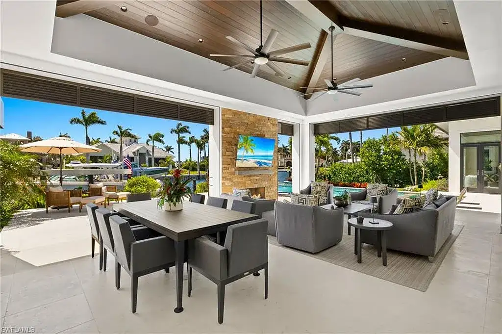 Front exterior view of 2500 Tarpon Rd Naples, a $11.995M modern coastal home for sale in Royal Harbor featuring canal frontage, luxury design, and saltwater pool