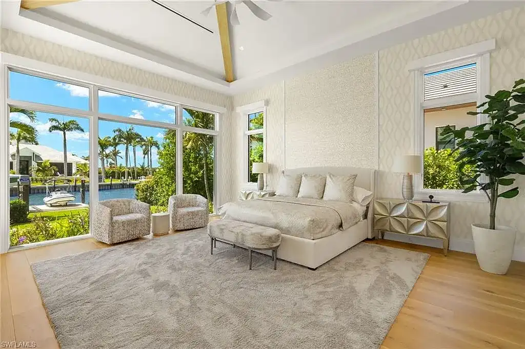 Front exterior view of 2500 Tarpon Rd Naples, a $11.995M modern coastal home for sale in Royal Harbor featuring canal frontage, luxury design, and saltwater pool
