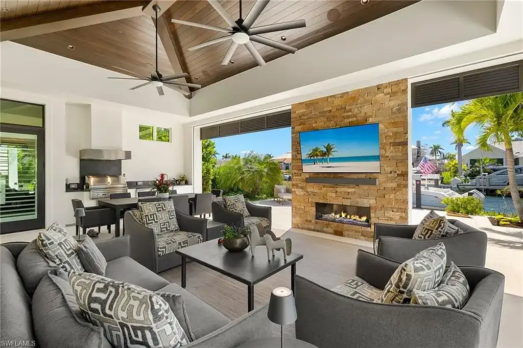 Front exterior view of 2500 Tarpon Rd Naples, a $11.995M modern coastal home for sale in Royal Harbor featuring canal frontage, luxury design, and saltwater pool