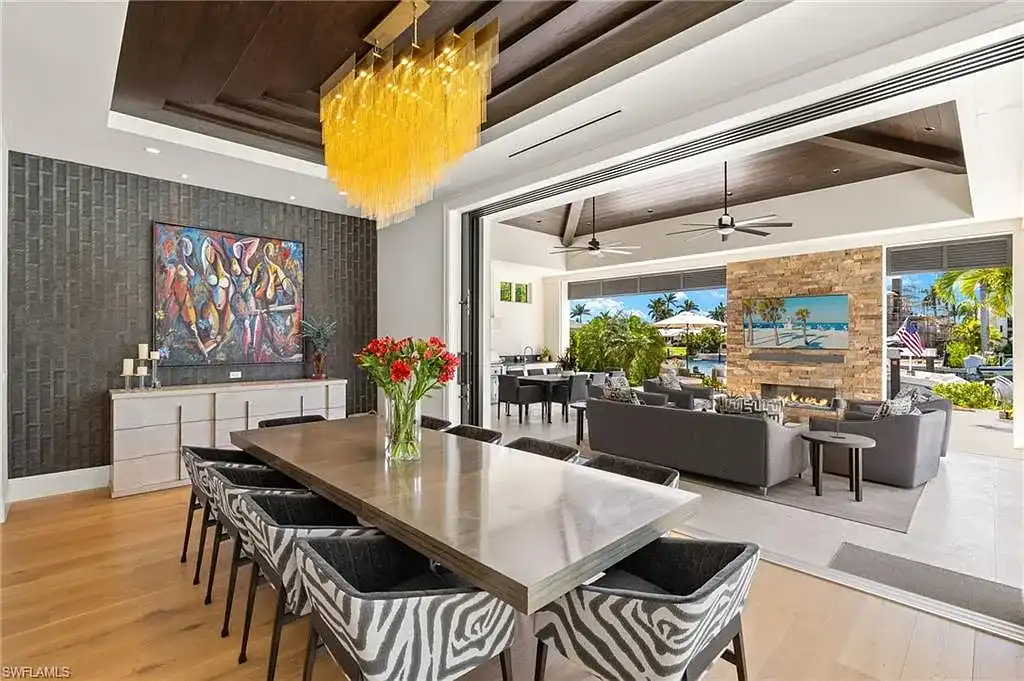 Front exterior view of 2500 Tarpon Rd Naples, a $11.995M modern coastal home for sale in Royal Harbor featuring canal frontage, luxury design, and saltwater pool