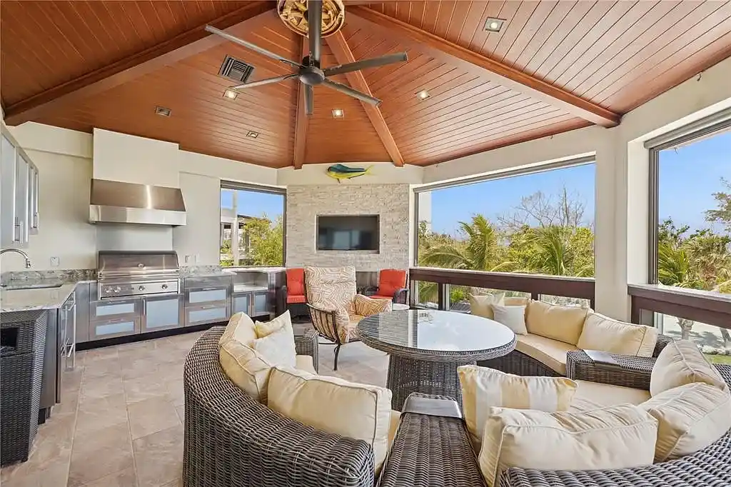 Luxury Gulf-front estate with private beach access and panoramic ocean views at 26 Sandy Hook Rd S, a high-end Sarasota home for sale.