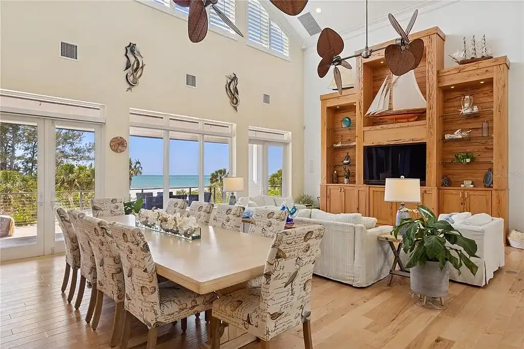 Luxury Gulf-front estate with private beach access and panoramic ocean views at 26 Sandy Hook Rd S, a high-end Sarasota home for sale.