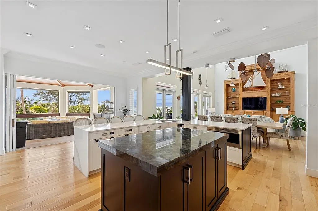 Luxury Gulf-front estate with private beach access and panoramic ocean views at 26 Sandy Hook Rd S, a high-end Sarasota home for sale.