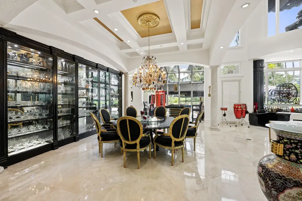 Courtyard estate at 319 Mizner Lake Estates Drive in Boca Raton, FL, featuring lakefront views, guest house, pool, and access to Boca Raton Resort amenities.