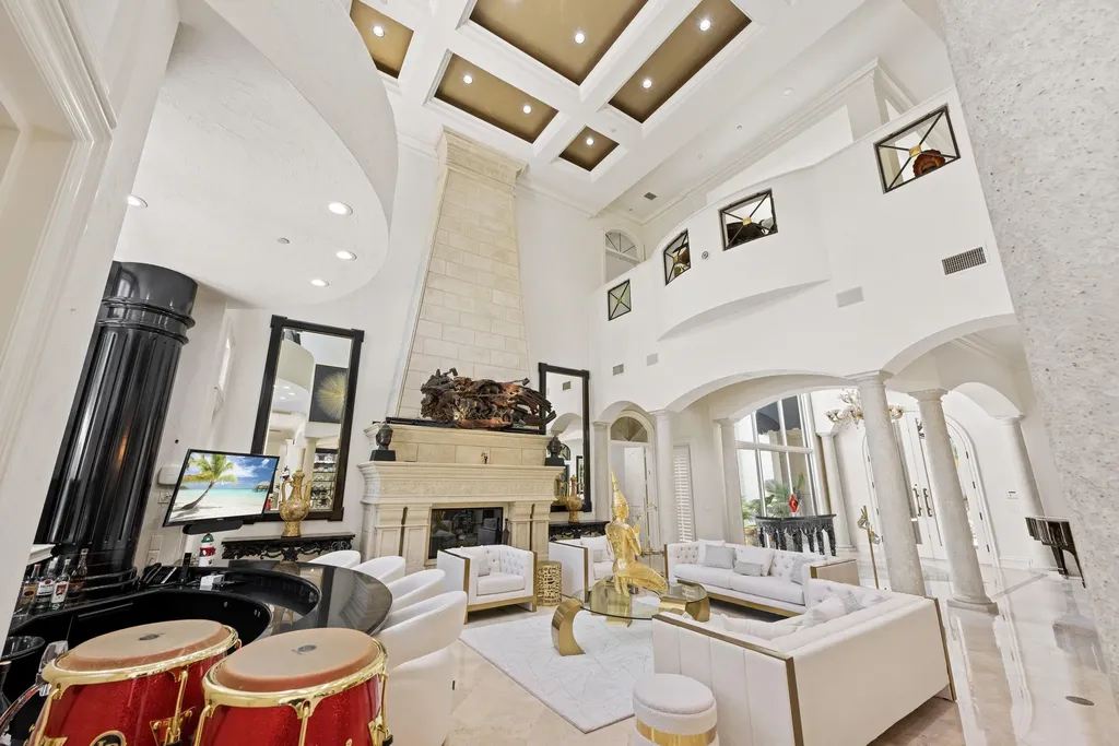 Courtyard estate at 319 Mizner Lake Estates Drive in Boca Raton, FL, featuring lakefront views, guest house, pool, and access to Boca Raton Resort amenities.