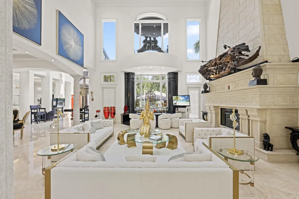 Courtyard estate at 319 Mizner Lake Estates Drive in Boca Raton, FL, featuring lakefront views, guest house, pool, and access to Boca Raton Resort amenities.
