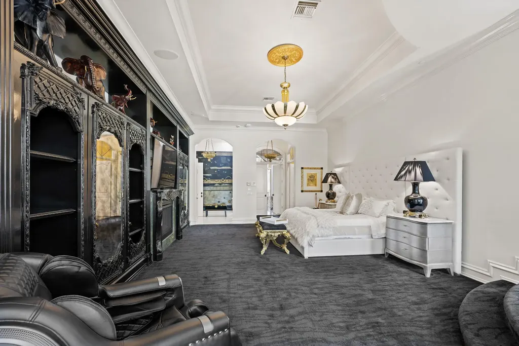 Courtyard estate at 319 Mizner Lake Estates Drive in Boca Raton, FL, featuring lakefront views, guest house, pool, and access to Boca Raton Resort amenities.