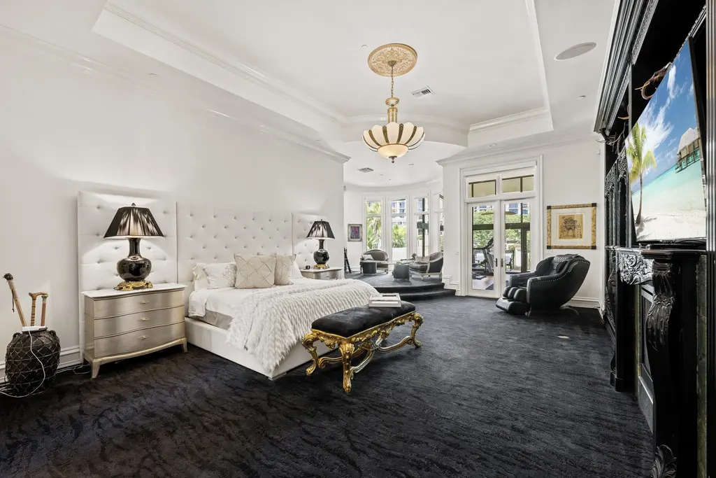 Courtyard estate at 319 Mizner Lake Estates Drive in Boca Raton, FL, featuring lakefront views, guest house, pool, and access to Boca Raton Resort amenities.