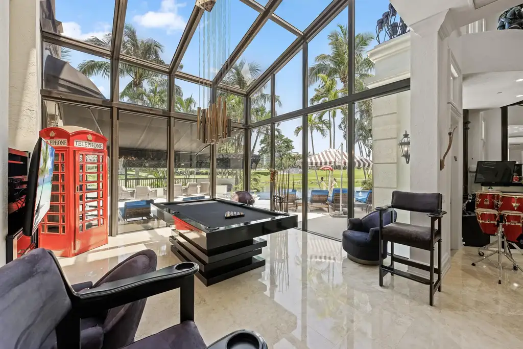 Courtyard estate at 319 Mizner Lake Estates Drive in Boca Raton, FL, featuring lakefront views, guest house, pool, and access to Boca Raton Resort amenities.