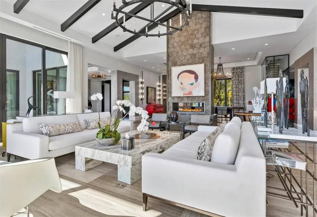 Balinese-inspired luxury waterfront estate at 3799 Flamingo Ave, Sarasota featuring infinity pool, koi pond, and tropical modern design
