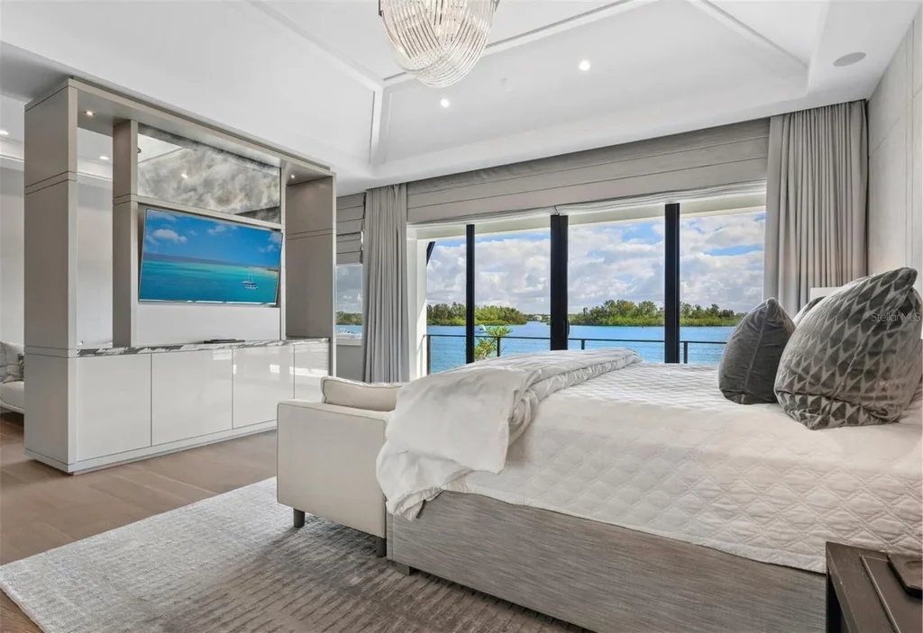 Balinese-inspired luxury waterfront estate at 3799 Flamingo Ave, Sarasota featuring infinity pool, koi pond, and tropical modern design