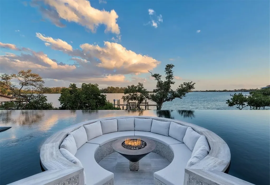 Balinese-inspired luxury waterfront estate at 3799 Flamingo Ave, Sarasota featuring infinity pool, koi pond, and tropical modern design
