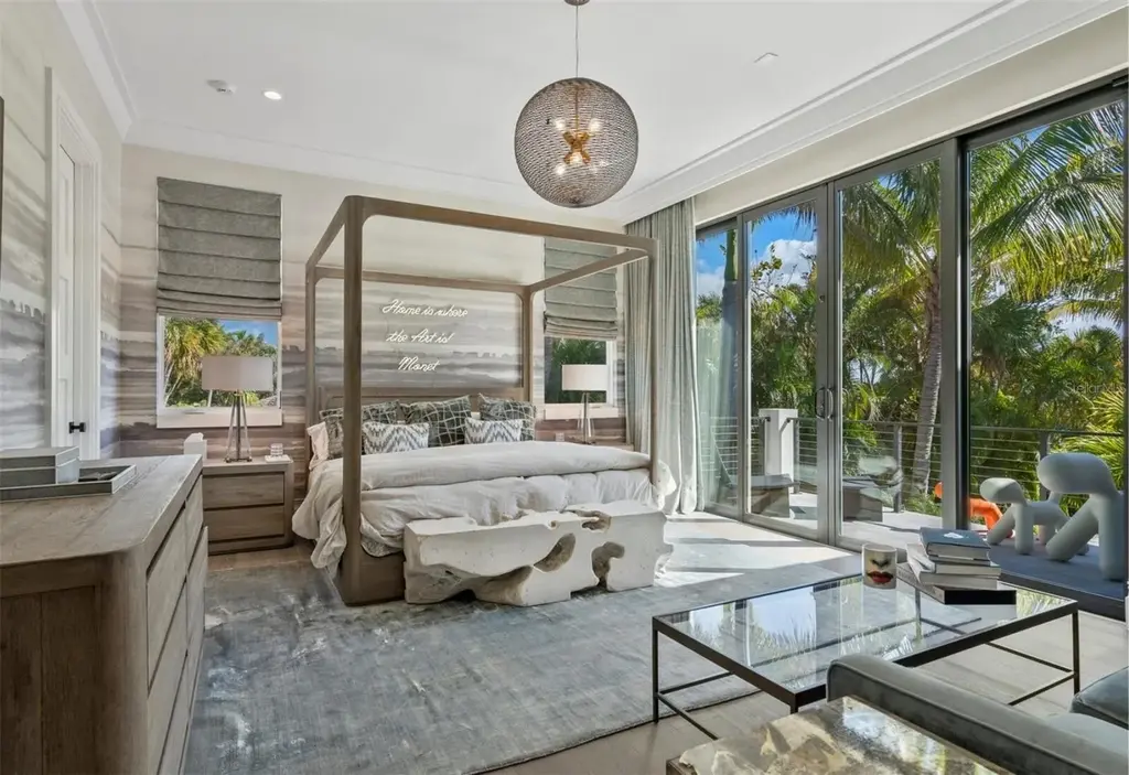 Balinese-inspired luxury waterfront estate at 3799 Flamingo Ave, Sarasota featuring infinity pool, koi pond, and tropical modern design