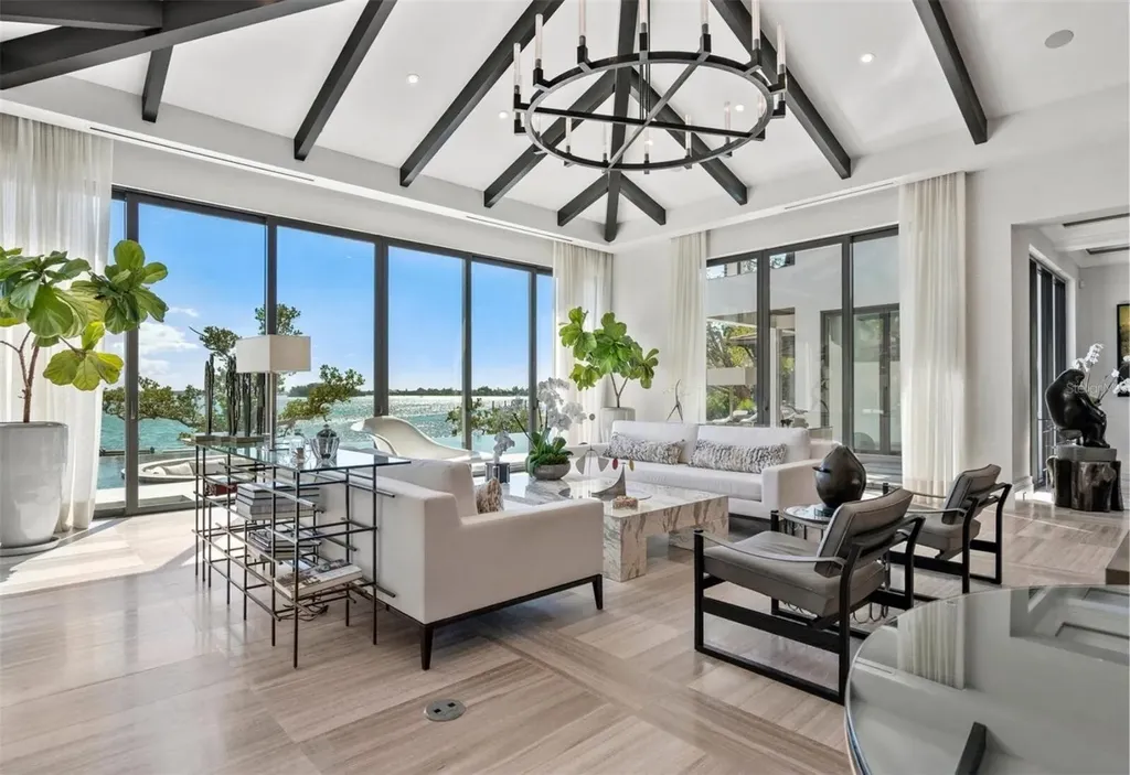 Balinese-inspired luxury waterfront estate at 3799 Flamingo Ave, Sarasota featuring infinity pool, koi pond, and tropical modern design