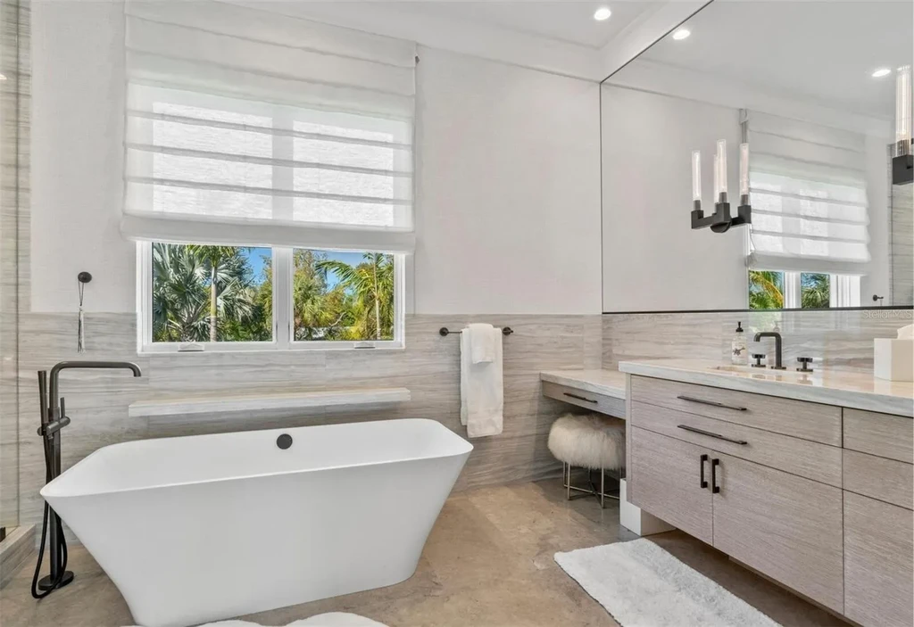 Balinese-inspired luxury waterfront estate at 3799 Flamingo Ave, Sarasota featuring infinity pool, koi pond, and tropical modern design