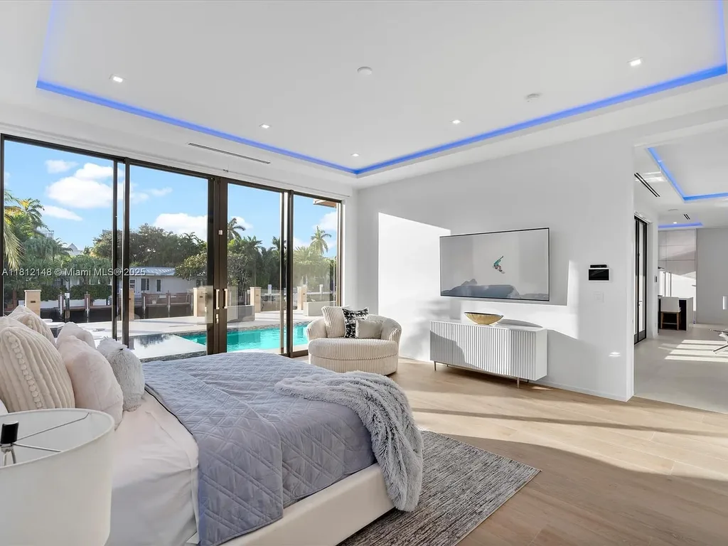 Aerial view of 401 Bontona Ave showcasing private dock, heated pool, and 75 feet of deep-water frontage
