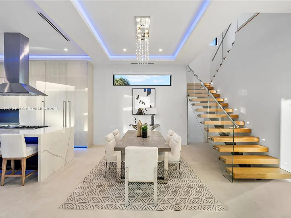 Aerial view of 401 Bontona Ave showcasing private dock, heated pool, and 75 feet of deep-water frontage