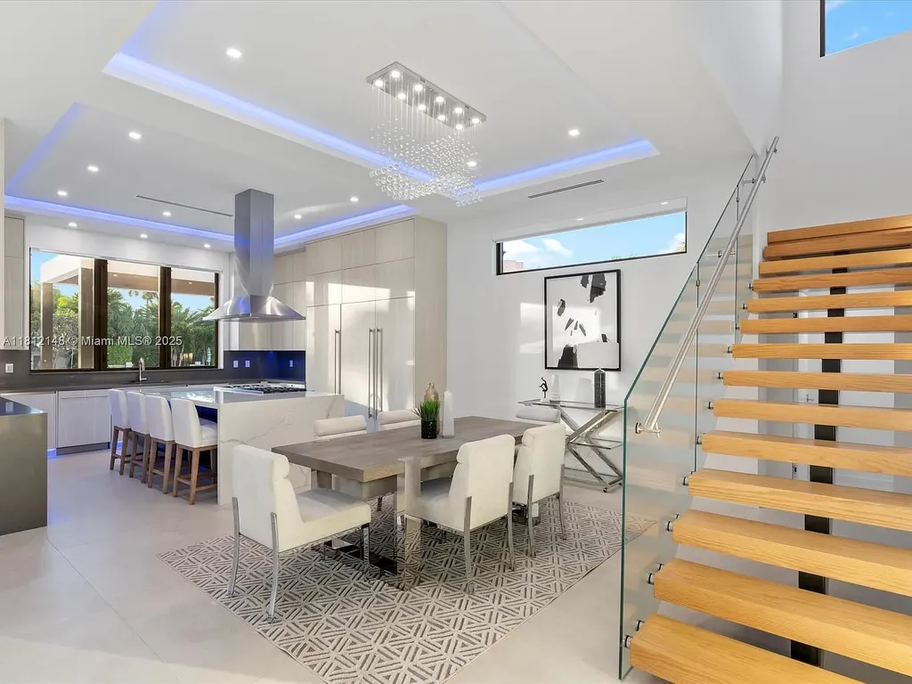Aerial view of 401 Bontona Ave showcasing private dock, heated pool, and 75 feet of deep-water frontage