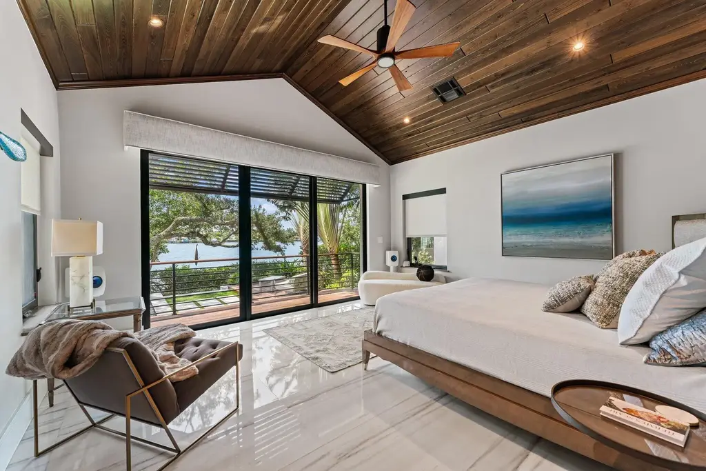 Waterfront estate at 5488 Pennock Point Road, Jupiter, Florida – featuring private dock, pool, and lush landscaping