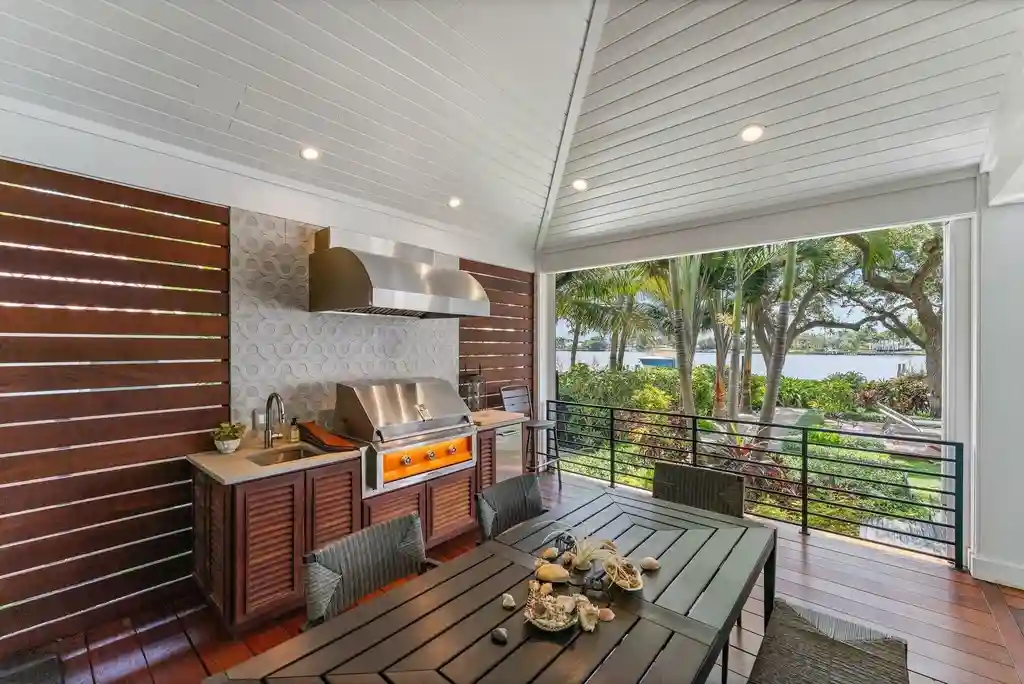 Waterfront estate at 5488 Pennock Point Road, Jupiter, Florida – featuring private dock, pool, and lush landscaping