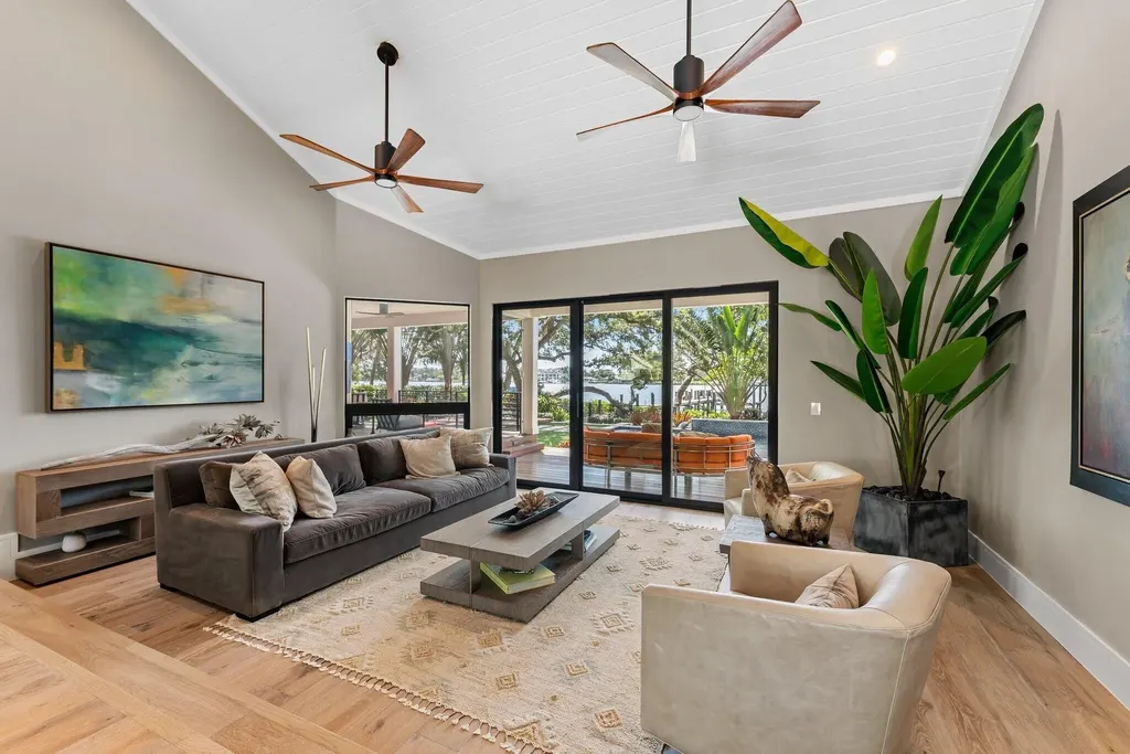 Waterfront estate at 5488 Pennock Point Road, Jupiter, Florida – featuring private dock, pool, and lush landscaping
