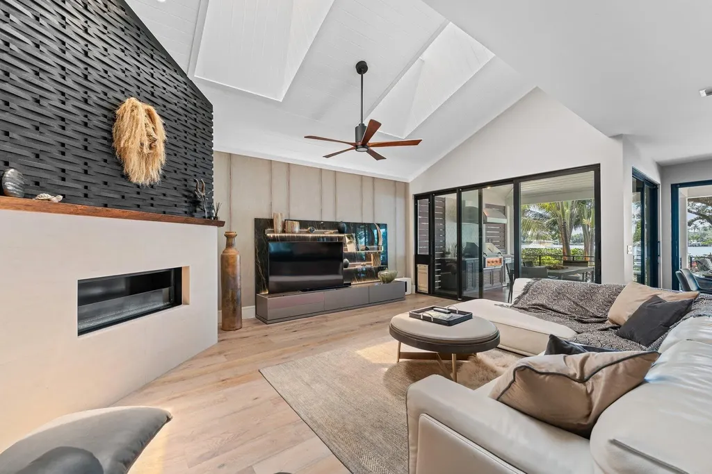 Waterfront estate at 5488 Pennock Point Road, Jupiter, Florida – featuring private dock, pool, and lush landscaping