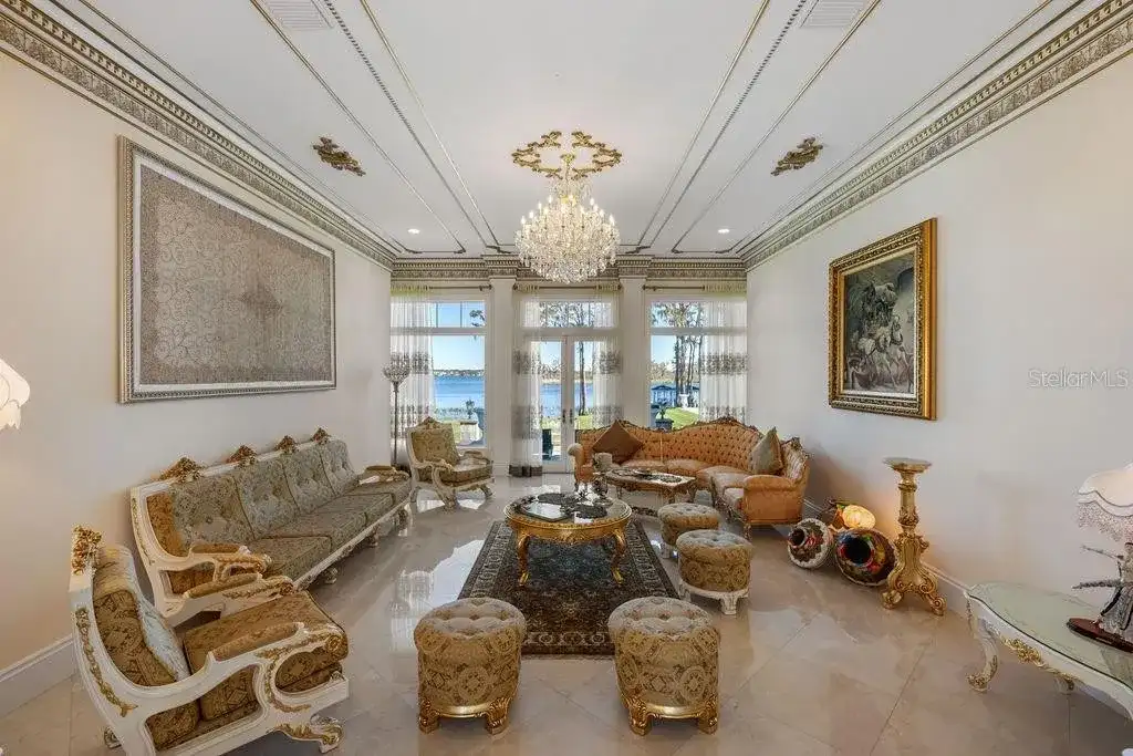 Lakefront luxury estate at 6139 Greatwater Dr in Windermere, featuring saltwater pool, summer kitchen, and panoramic views of Lake Tibet.