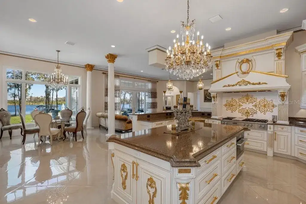 Lakefront luxury estate at 6139 Greatwater Dr in Windermere, featuring saltwater pool, summer kitchen, and panoramic views of Lake Tibet.