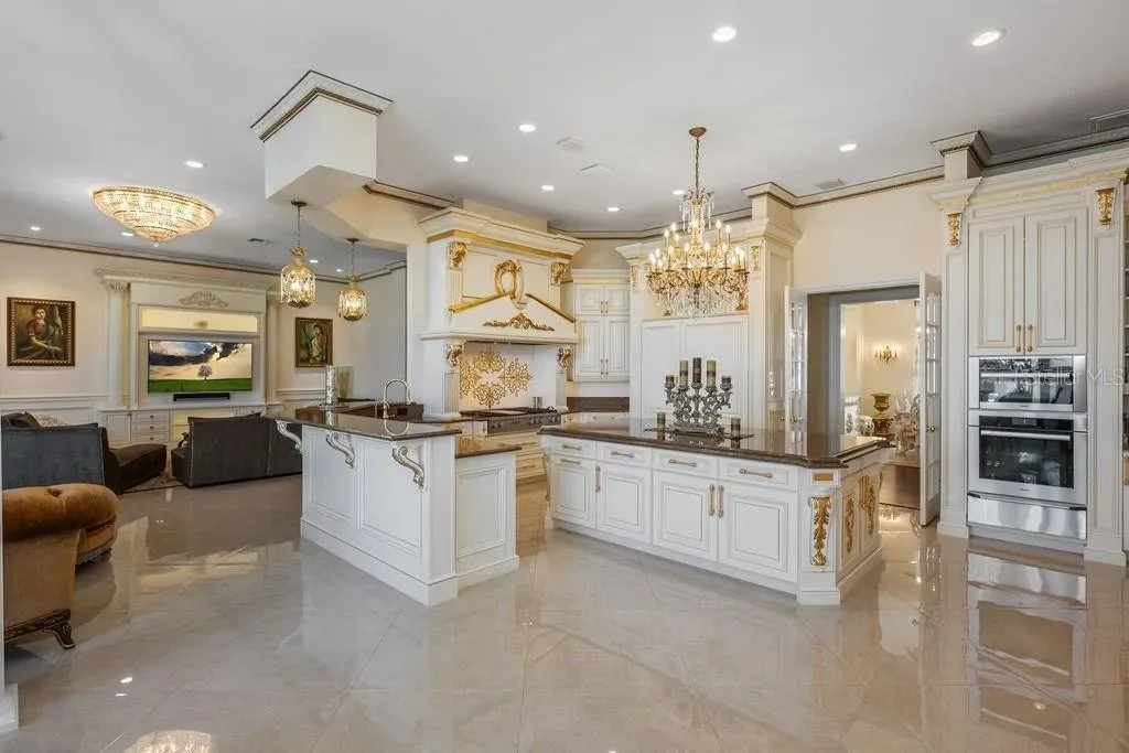 Lakefront luxury estate at 6139 Greatwater Dr in Windermere, featuring saltwater pool, summer kitchen, and panoramic views of Lake Tibet.