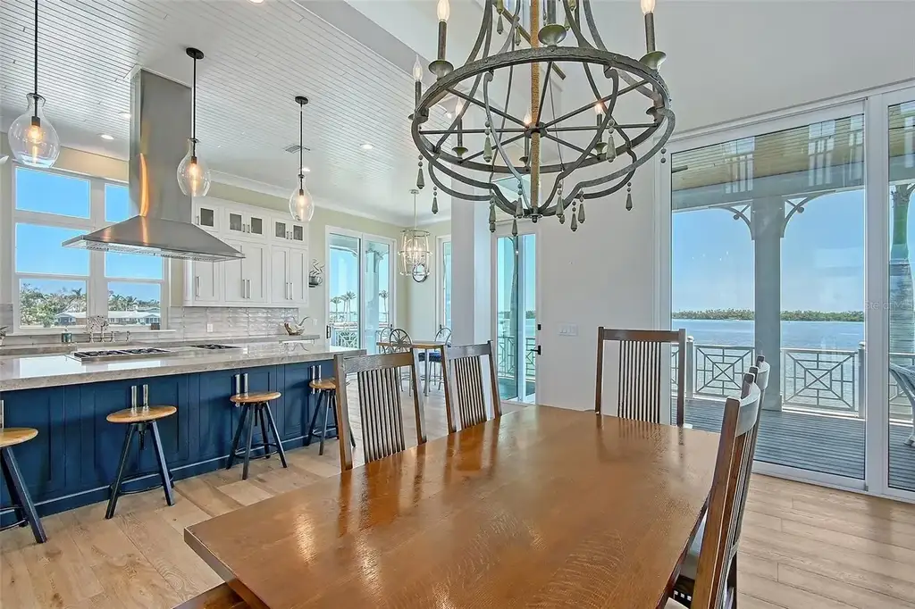 Aerial view of 630 De Narvaez Dr, a luxury bayfront estate in Longboat Key with 880 feet of private shoreline and resort-style pool