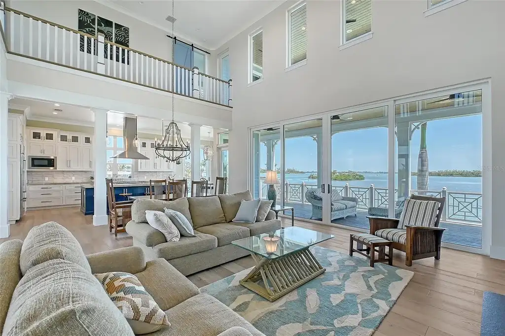 Aerial view of 630 De Narvaez Dr, a luxury bayfront estate in Longboat Key with 880 feet of private shoreline and resort-style pool