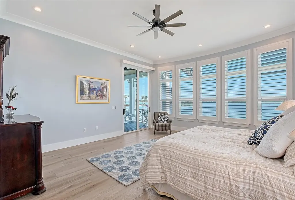 Aerial view of 630 De Narvaez Dr, a luxury bayfront estate in Longboat Key with 880 feet of private shoreline and resort-style pool