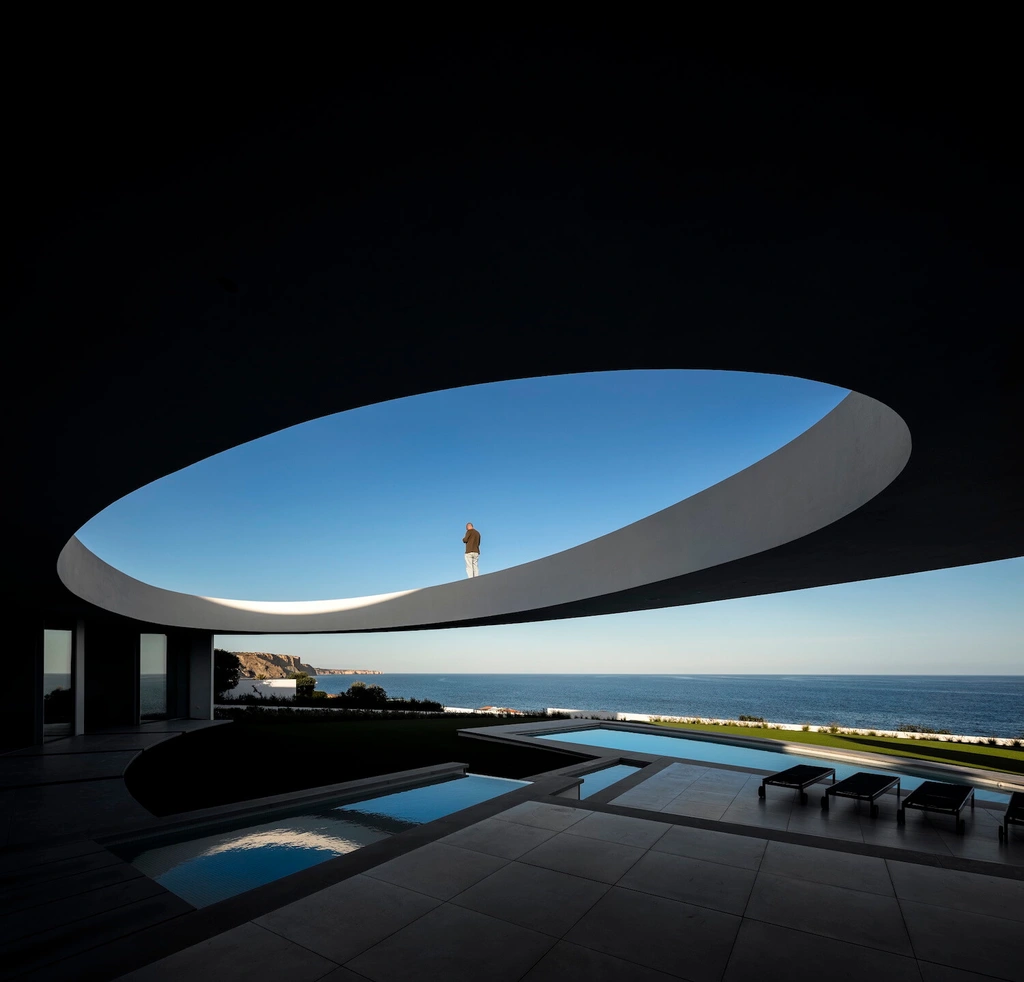 Elliptical House in Lagos, Portugal by Mário Martins Atelier Merges Sculptural Form with Landscape Harmony