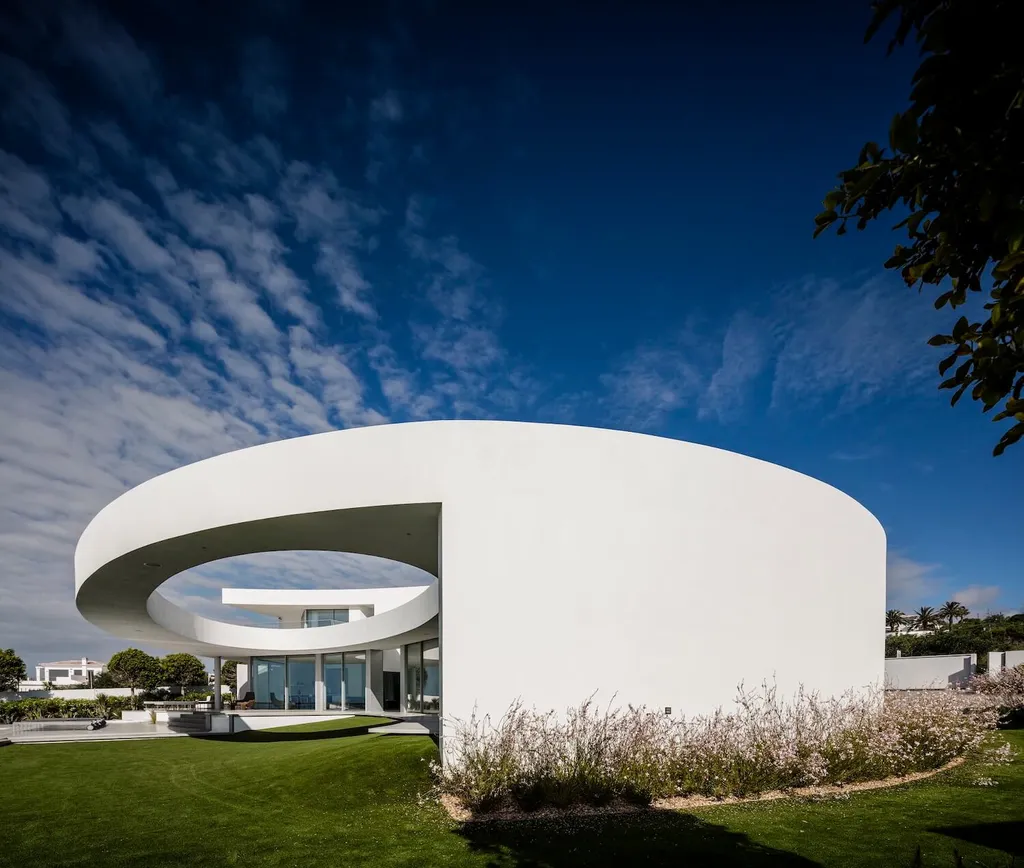 Elliptical House in Lagos, Portugal by Mário Martins Atelier Merges Sculptural Form with Landscape Harmony
