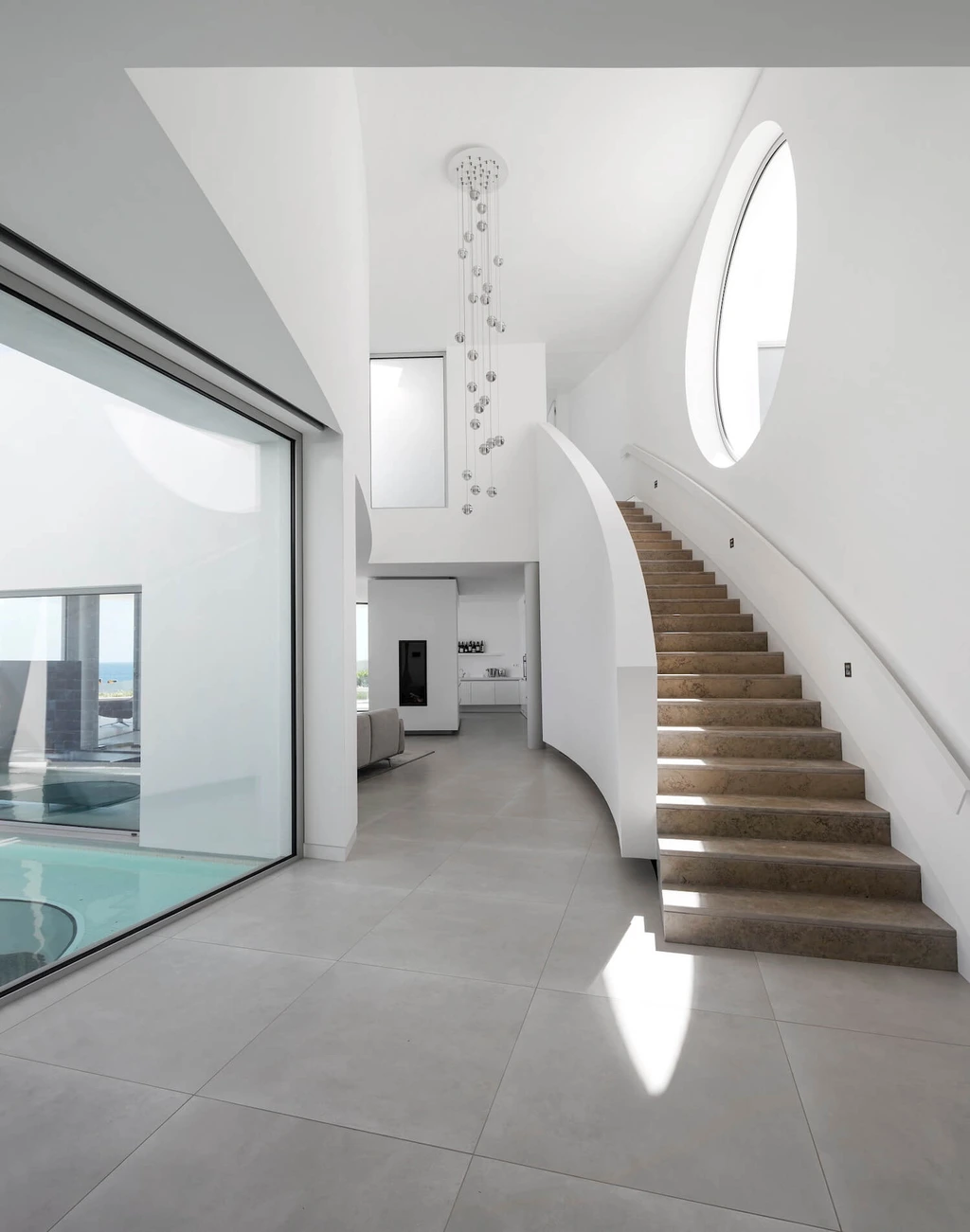 Elliptical House in Lagos, Portugal by Mário Martins Atelier Merges Sculptural Form with Landscape Harmony