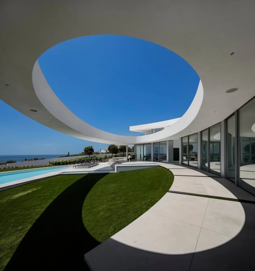 Elliptical House in Lagos Portugal by Mario Martins Atelier Merges Sculptural Form with Landscape Harmony 2