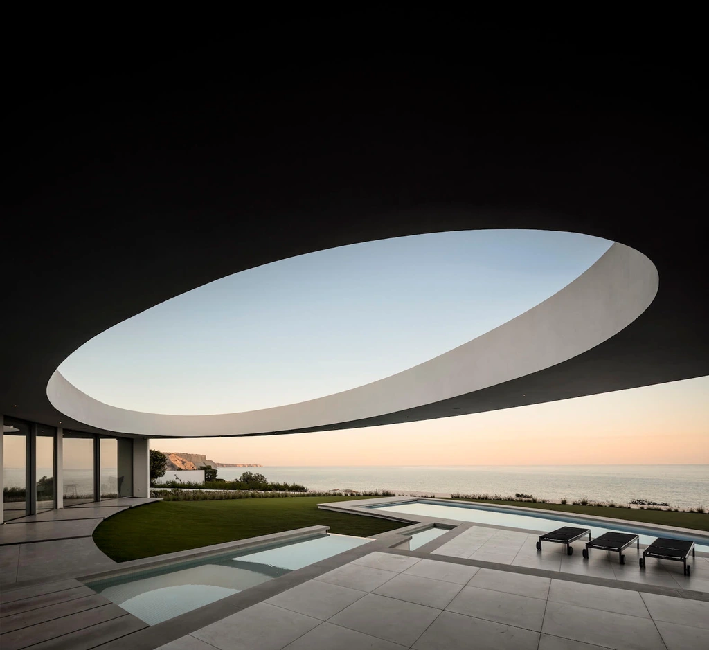 Elliptical House in Lagos, Portugal by Mário Martins Atelier Merges Sculptural Form with Landscape Harmony
