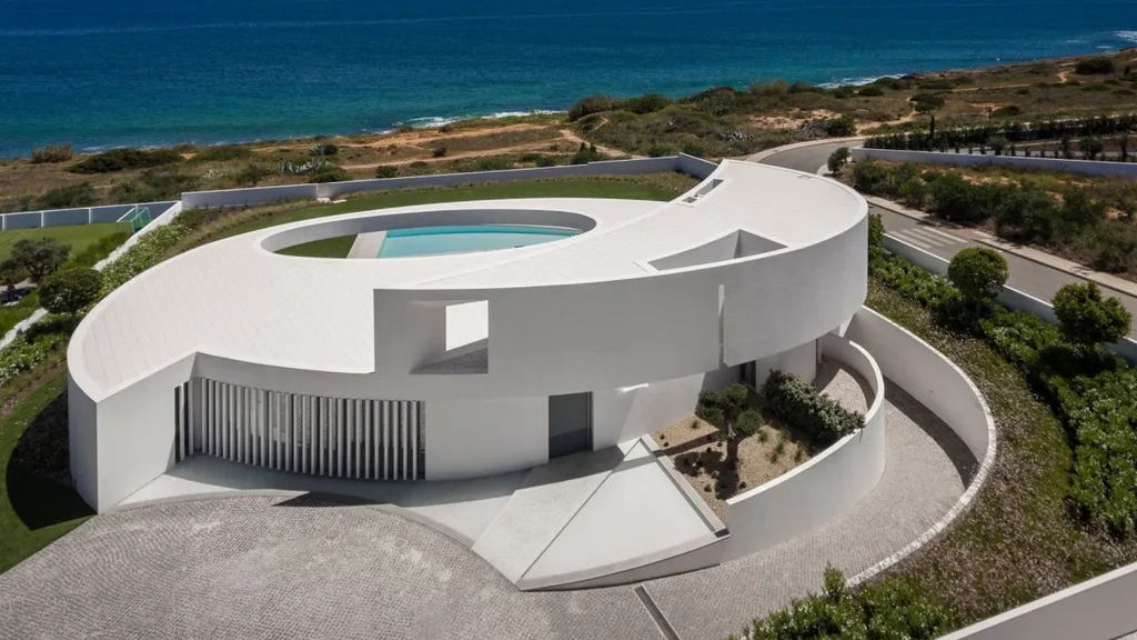 Elliptical House in Lagos, Portugal by Mário Martins Atelier Merges Sculptural Form with Landscape Harmony