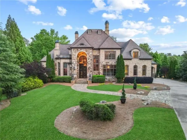 Picture-Perfect Luxury: $2.98M Estate on Greg Norman Golf Course with Spectacular Lakefront Views