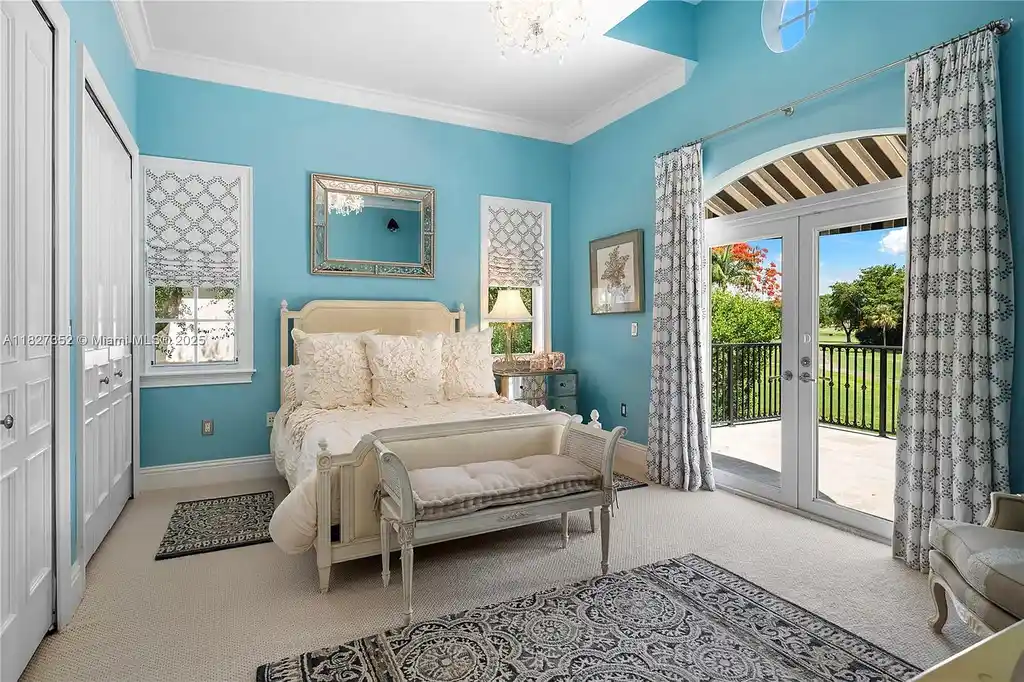 Front exterior view of 1171 Tiara Ct Coral Gables – a $5.1M luxury home with black-bottom pool, golf course views, and elegant Mediterranean-inspired architecture.