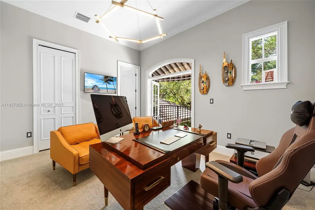 Front exterior view of 1171 Tiara Ct Coral Gables – a $5.1M luxury home with black-bottom pool, golf course views, and elegant Mediterranean-inspired architecture.
