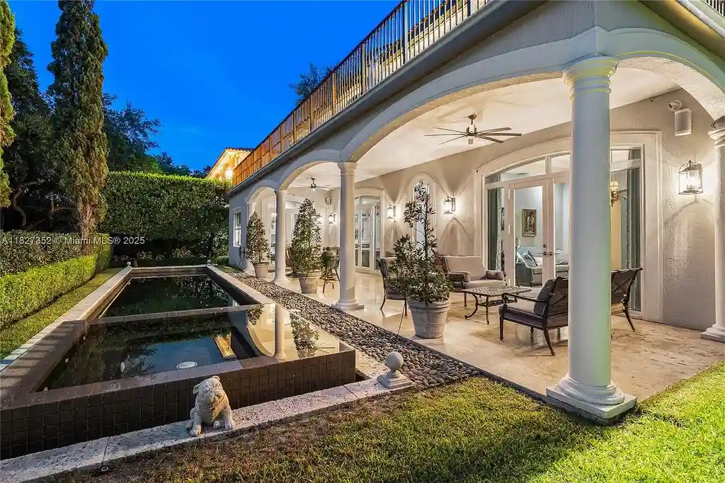 Front exterior view of 1171 Tiara Ct Coral Gables – a $5.1M luxury home with black-bottom pool, golf course views, and elegant Mediterranean-inspired architecture.