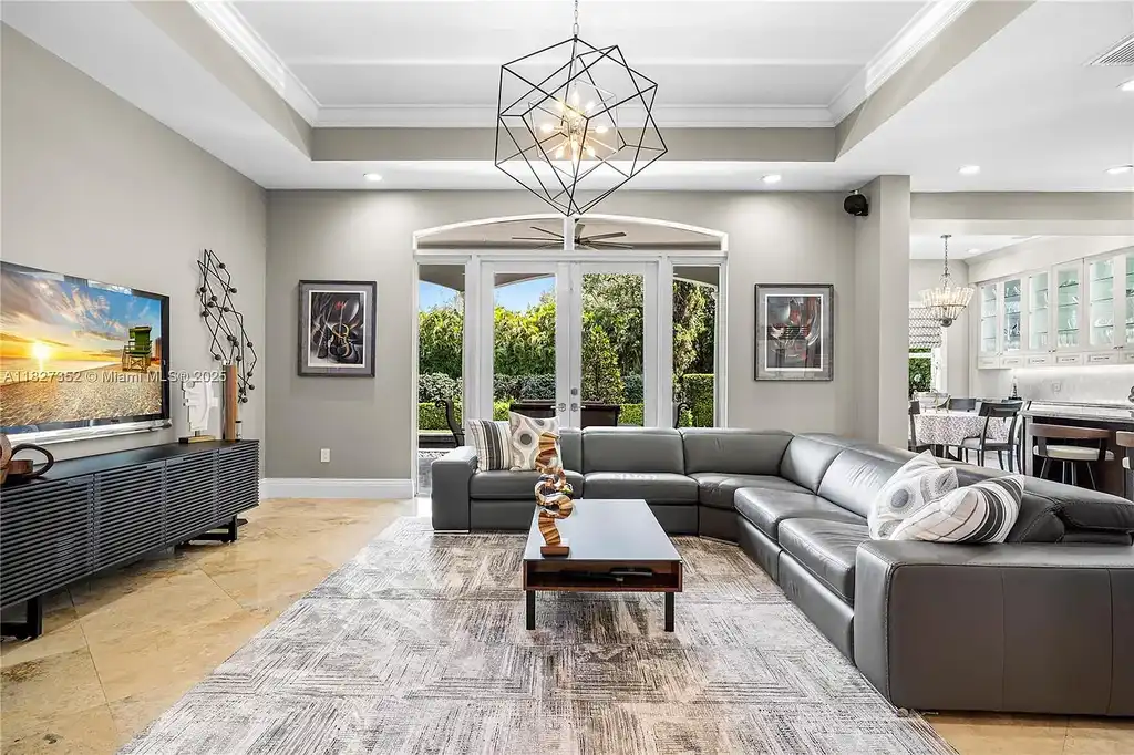 Front exterior view of 1171 Tiara Ct Coral Gables – a $5.1M luxury home with black-bottom pool, golf course views, and elegant Mediterranean-inspired architecture.