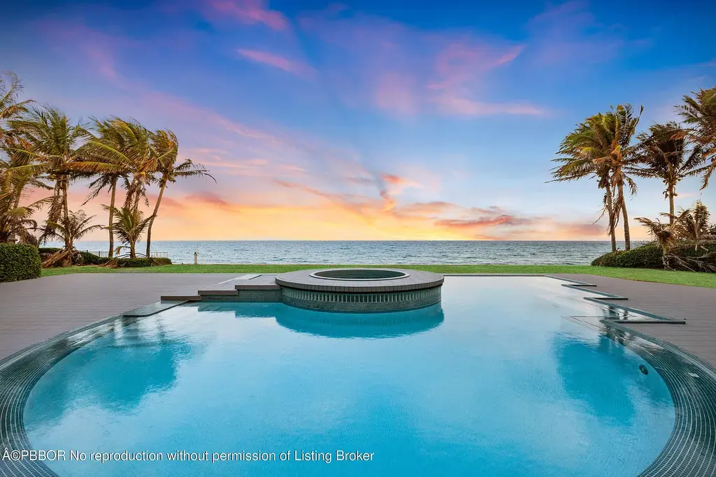Aerial view of 1200 S Ocean Blvd Manalapan showcasing ocean-to-lake frontage, luxury estate with private pool, tennis court, and direct beach access