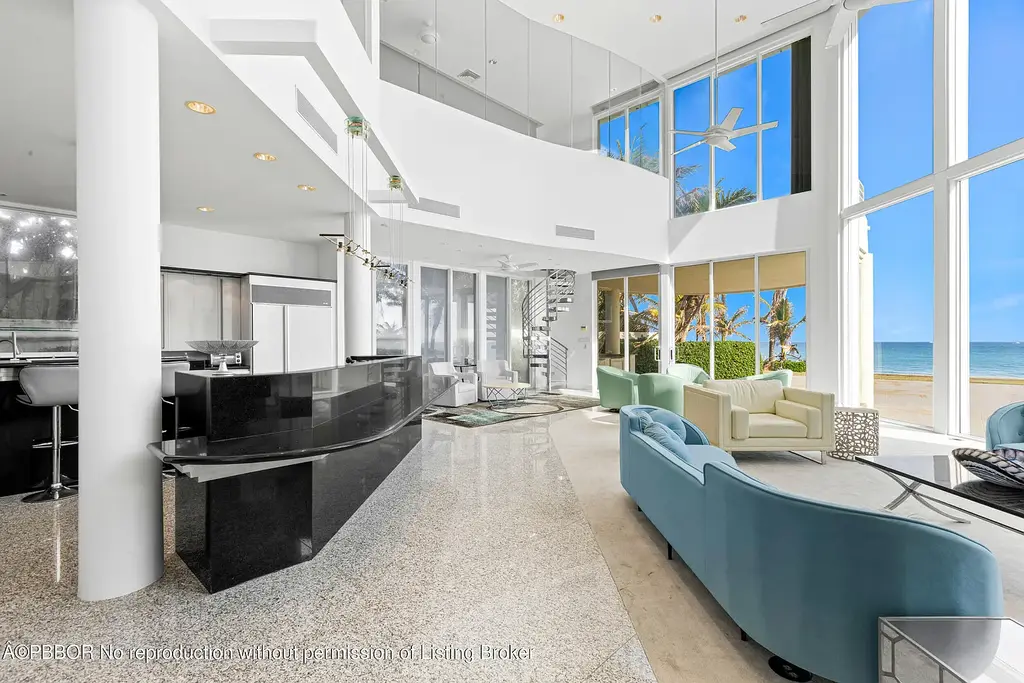 Aerial view of 1200 S Ocean Blvd Manalapan showcasing ocean-to-lake frontage, luxury estate with private pool, tennis court, and direct beach access