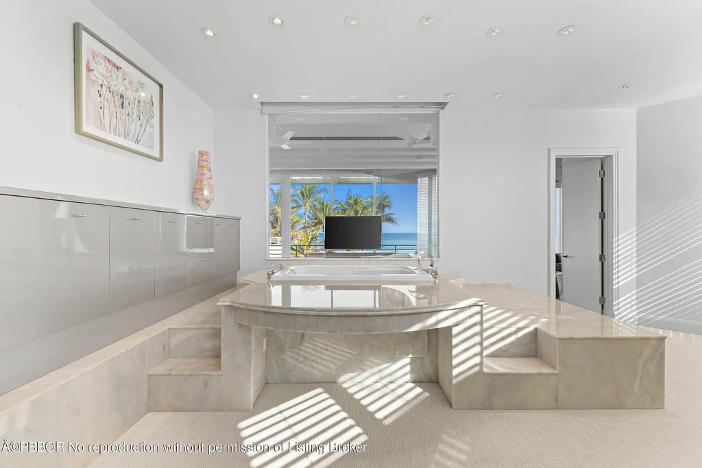 Aerial view of 1200 S Ocean Blvd Manalapan showcasing ocean-to-lake frontage, luxury estate with private pool, tennis court, and direct beach access