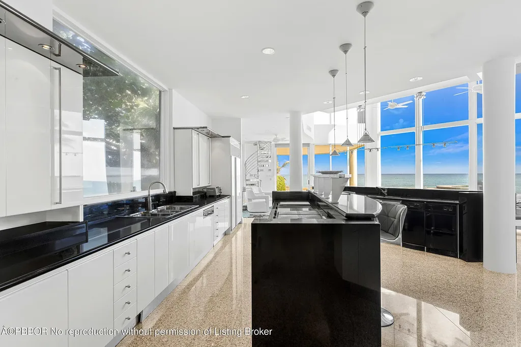 Aerial view of 1200 S Ocean Blvd Manalapan showcasing ocean-to-lake frontage, luxury estate with private pool, tennis court, and direct beach access