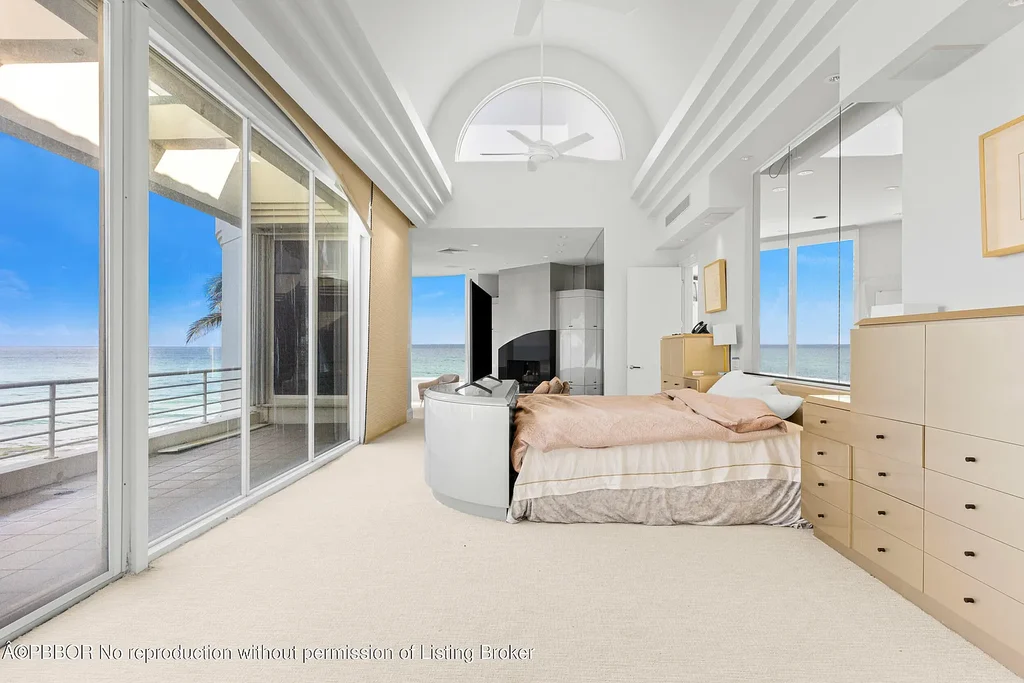 Aerial view of 1200 S Ocean Blvd Manalapan showcasing ocean-to-lake frontage, luxury estate with private pool, tennis court, and direct beach access